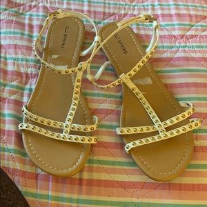 Sandals white, with gold bullets.